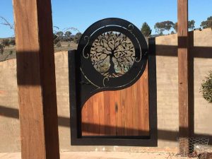 laser cut metal gate with tree design