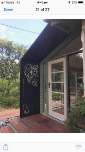 laser cut metal screen on a house
